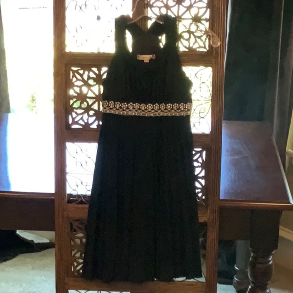 Black dress with rhinestone trim.